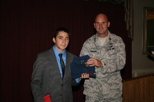 Davin Baker (l), product manager, SafeNet Incorporated, receives a token of thanks from Capt. Ian Johnson, USAF, systems telecommunications engineering manager, 38th Cyberspace Engineering Group, and chapter executive vice president, for speaking at the September luncheon.